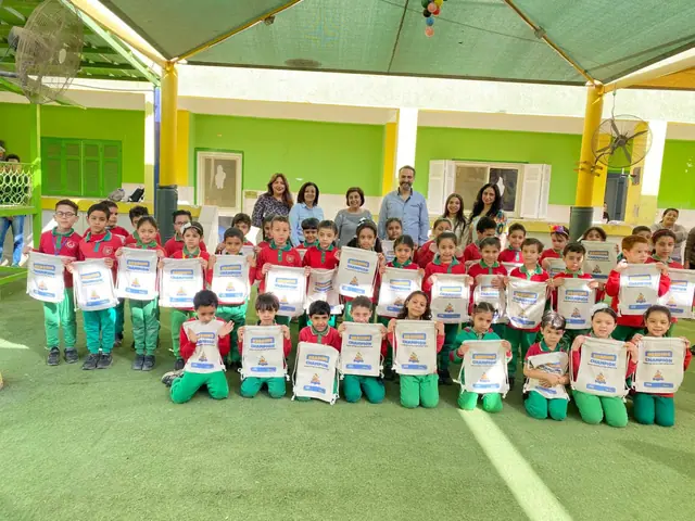 Reading Champion day — students holding their Bee Degree bags with the Rockets Learning team